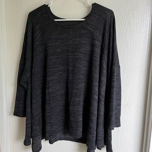 Black poncho like top.